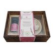 Aromatherapy gift set with diffuser and candle in a wooden box, featuring a pink packaging label.