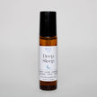 Roll-on bottle labeled 'Deep Sleep' on a light gray background