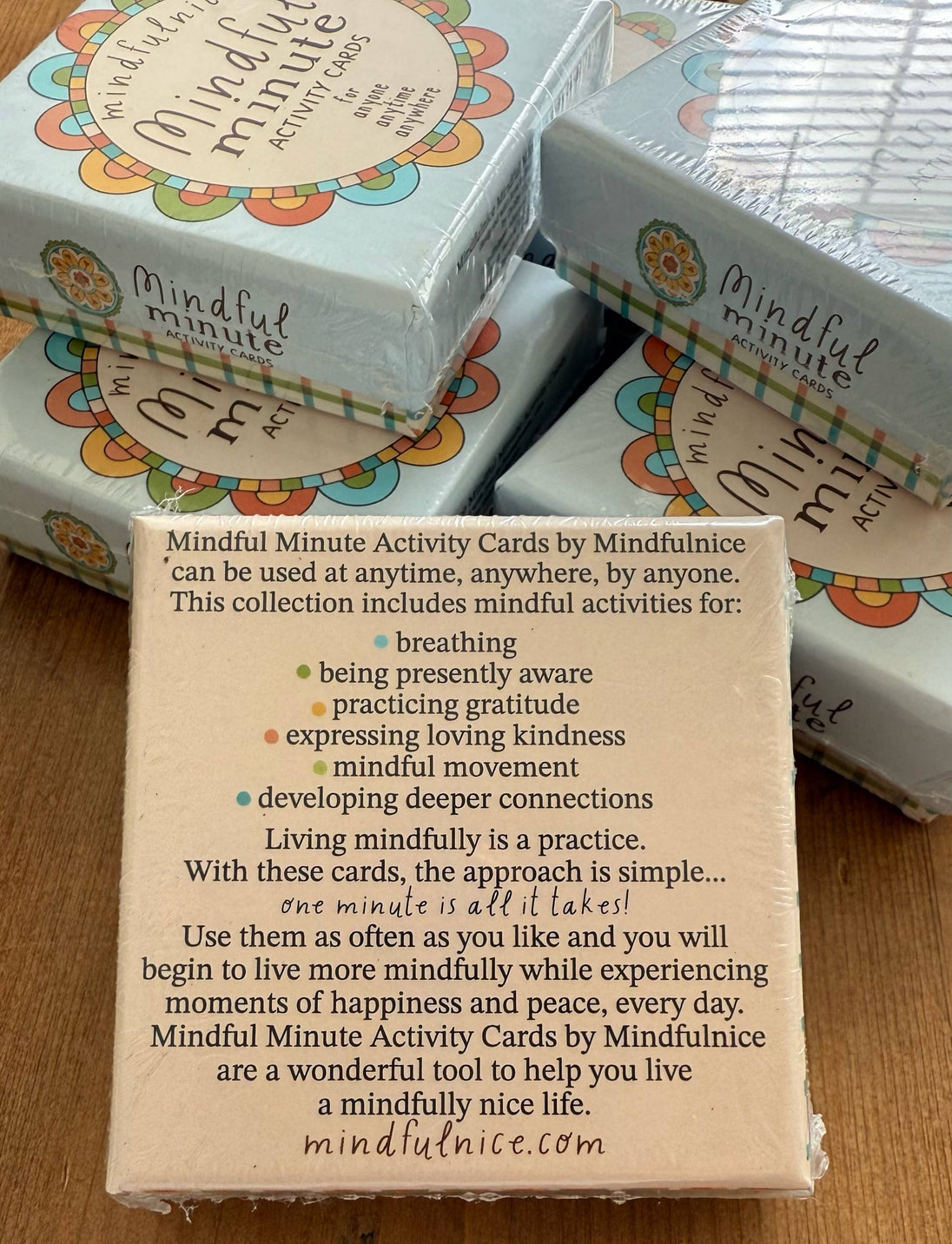 Box of Mindful Minute Activity Cards by Mindfulnice on a wooden surface