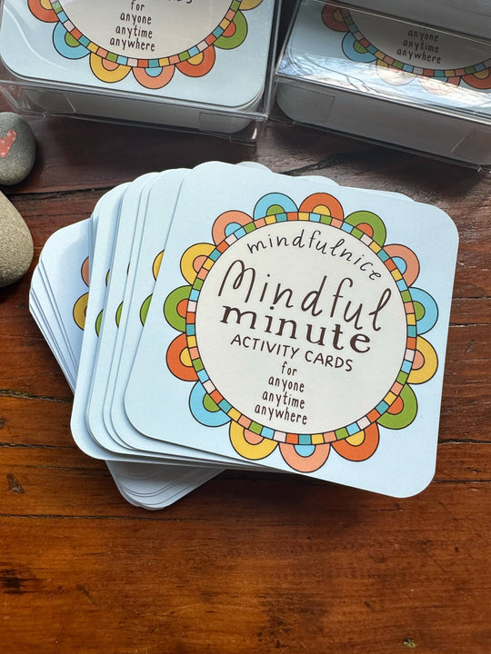 Stack of 'Mindful Minute Activity Cards' on a wooden surface