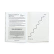 Open book with text and a line drawing on a white background