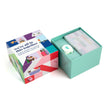 Colorful box with a card and small item on a white background