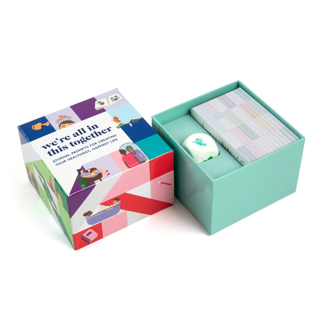 Colorful box with a card and small item on a white background